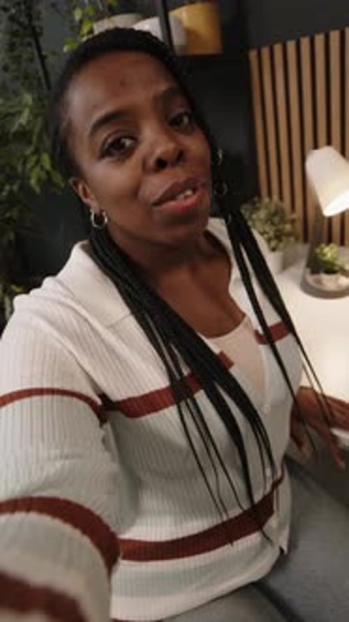 UGC of Young African American Woman Recording Vlog in Green Office