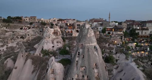 Aerial View of Natural Rock Formations in the Sunset Valley with Cave Houses in Cappadocia Turkey