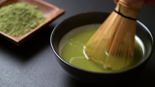 making matcha green tea in Japanese style