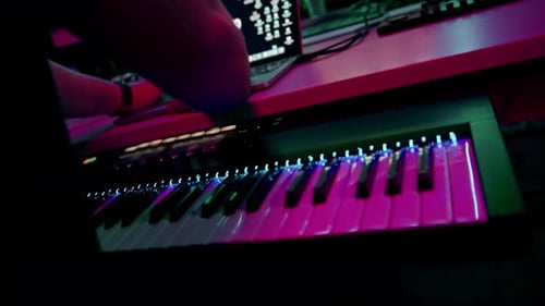 professional sound recording studio sound engineer or music producer sitting at the remote control