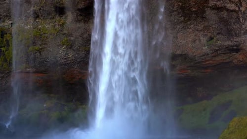 Large natural waterfall in Iceland. Seljalandsfoss waterfall. Close shot.