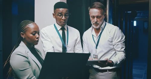 Team of IT Professionals in Server Room