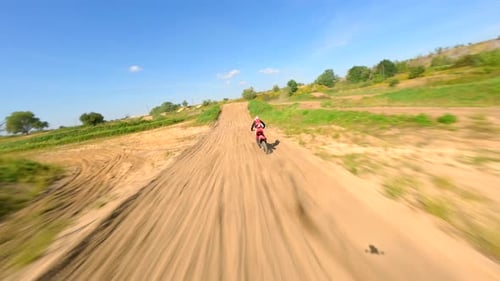 Motocross Rider Racing on a Dirt Track