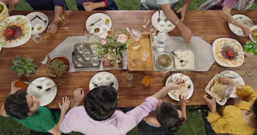 Big Indian Family Lunch Table: Top Down Elevated View at a Family and Friends Celebrating Outside