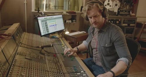 Sound Engineer Recording in Music Studio