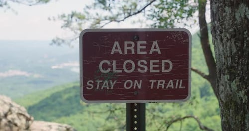 Brown sign in state or national park marking Area Closed. Signage for tourists and park visitors. Pr