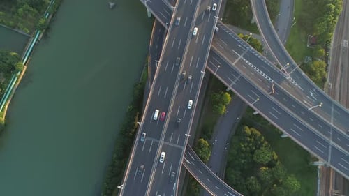 Aerial Drone View of Highway Multilevel Junction Road with Moving Cars at Sunset Active Movement of