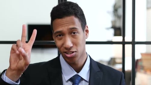 Victory Sign By Black Businessman