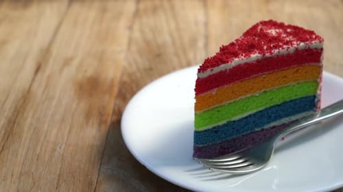 Rainbow Cake Slice on Plate with Fork