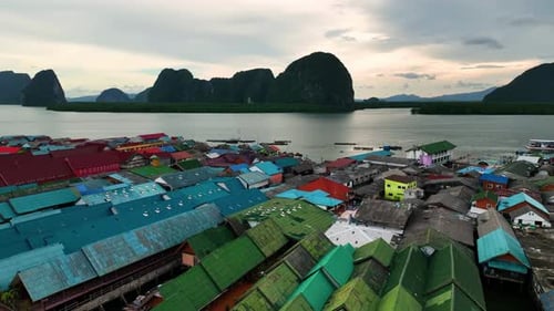 Aerial view of colorful rooftops of floating village, Thailand.