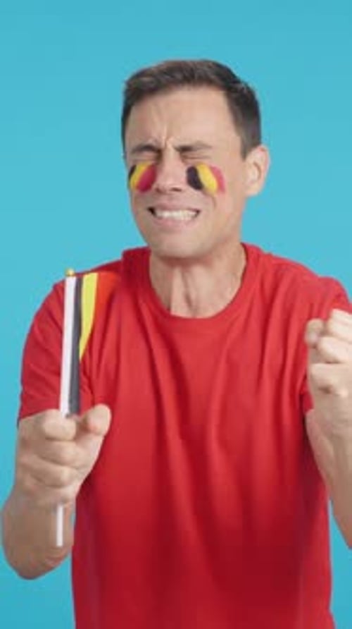 Man Cheering for Belgium During a Match That is Lost