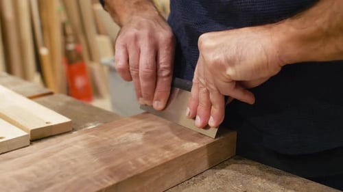 Carpenter Shaving Wood Plank Close-up