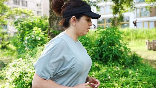 Young Woman Runner Training in Summer Park Close Up Fitness Woman Jogging Outdoor Morning Running