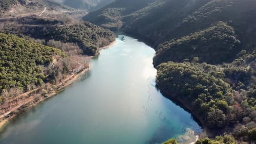 drone video over mountain lake at sunrise