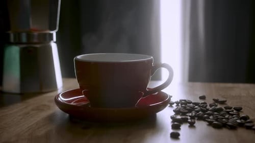 Steaming Coffee Cup with Coffee Beans on Table