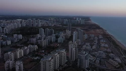 Aerial view of the city of Netanya and its coastline - part of the Israeli coastal plain, at sunset
