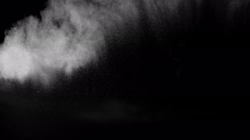 Sahara Collection: Sand dust thrown across and falling from the top and scattering slowly over a bla