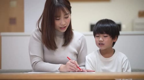 Adult and Child working on school assignment