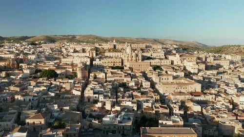 City Of Noto With Streets, Buildings, Italian Houses And The Cathedral In Sicily, Italy - aerial dro