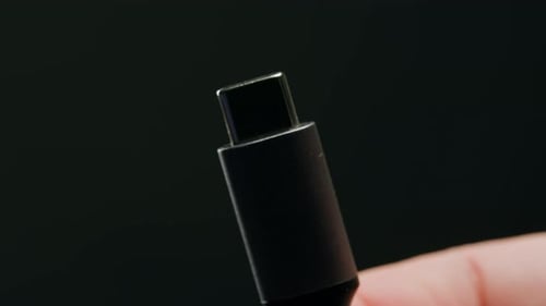 Charging Connection to Smartphone on Black Background Closeup Phone Charging Port USB Wire for