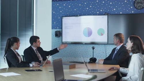 Team Of Office Workers Have Conversation in Conference Room.