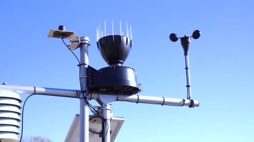 Weather station with instruments under clear blue sky in closeup