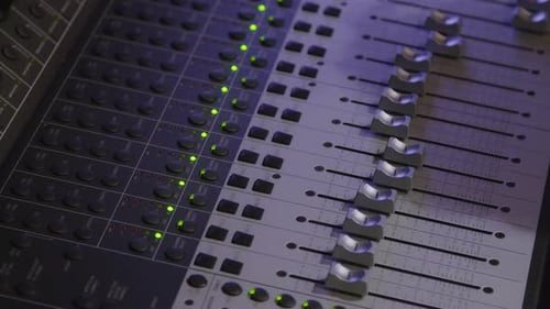 Mixer Board in Sound Recording Studio With Human Shadow On It.