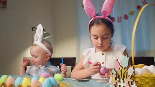 Happy Children Having Fun and Fooling Around While Decorating Easter Eggs