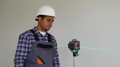 Indian Man Adjusting Laser Level Tool Laser Leveler Device