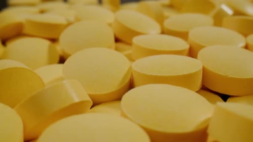 Pills and Vitamins Macro Close Up View of Womans Hands Holding Plenty of Different Drugs Painkillers
