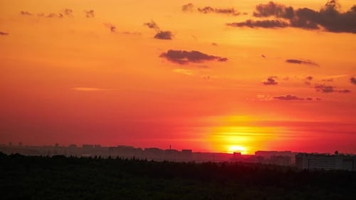 Evening sky with setting sun through clouds at sunset, cloudy landscape