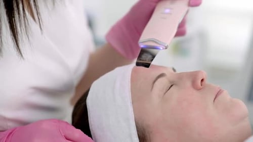 Woman Receiving Facial Treatment at a Spa