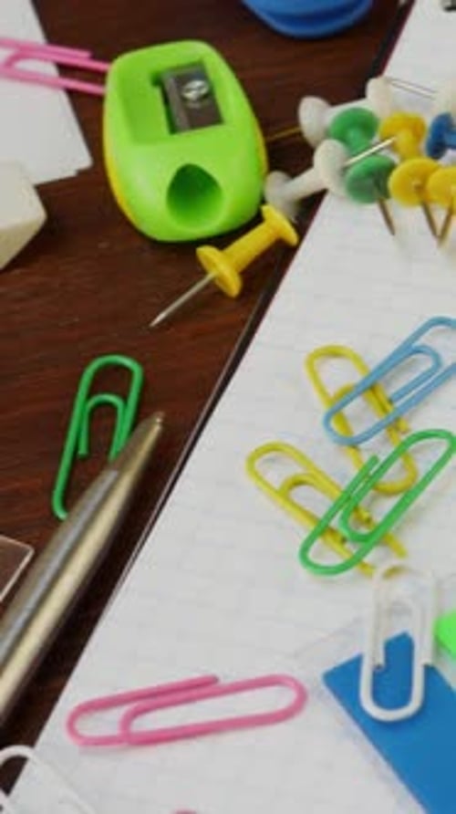 School and Office Supplies Arranged on a Notepad