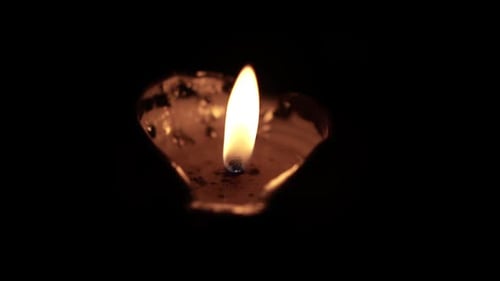 Single Candle Flame Burning in the Dark