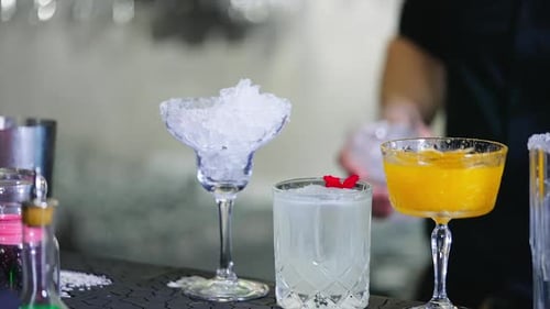 Bartender Prepares Various Cocktails with Ice