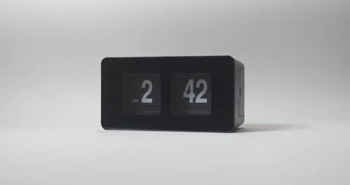 Close Up of White Time Display on a Black Digital Alarm Clock with Time Going Off at 3PM