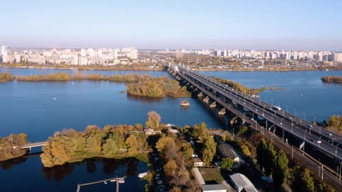 Aerial Drone Flight View of Cityscape with Highway Bridge