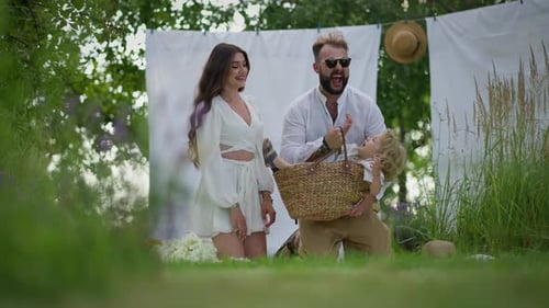 Happy Family Playing in the Countryside Together