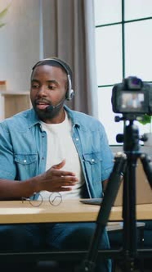Man with Headset Talking to Camera in Home