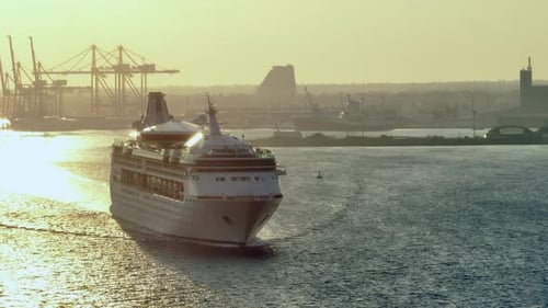 Cruise Ship Sailing on Calm Water During Sunrise