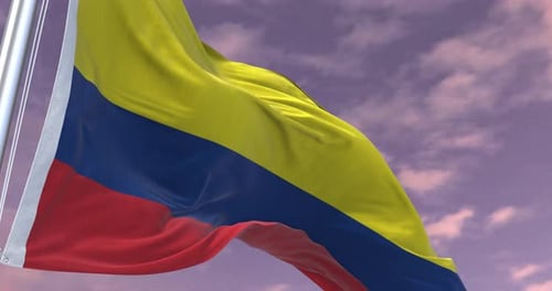 Realistic Colombian Flag Waving in the Wind against a Cloudy Sky