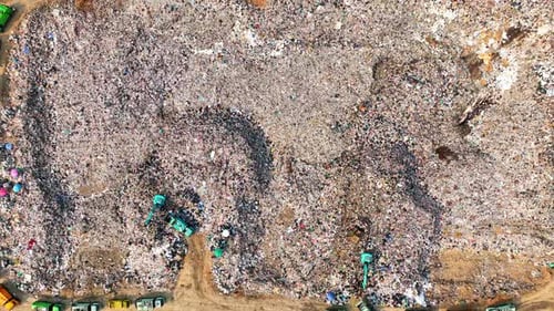 An aerial view over a landfill. 4K.
