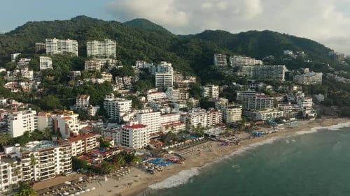 Beachfront resorts in Puerto Vallarta at sunset, Mexico. Aerial