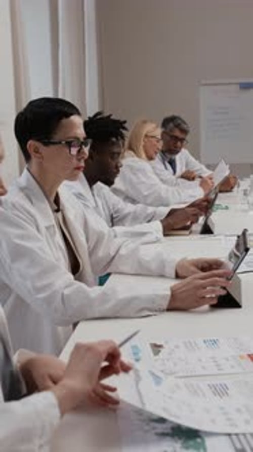 Doctors Reviewing Data in a Conference Room