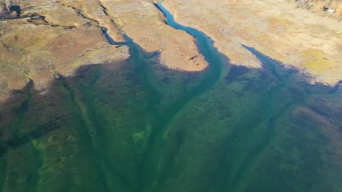 Aerial drone view of low levels of water in the lake. Shortage of water. Climate change.