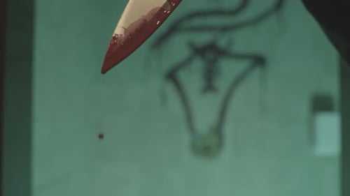 Bloodied knife dripping in blood - slow