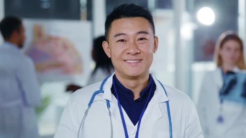 Friendly Doctor Smiles in Bright Hospital Setting