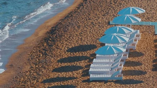 Lounge Chairs in a Deserted Beach