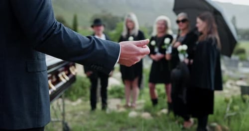 Funeral, hands or priest with speech at graveyard, memorial service or tribute for religious