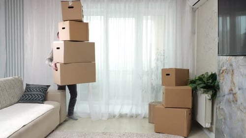 Man Carries Boxes Stack and Falls on Floor in New Apartment